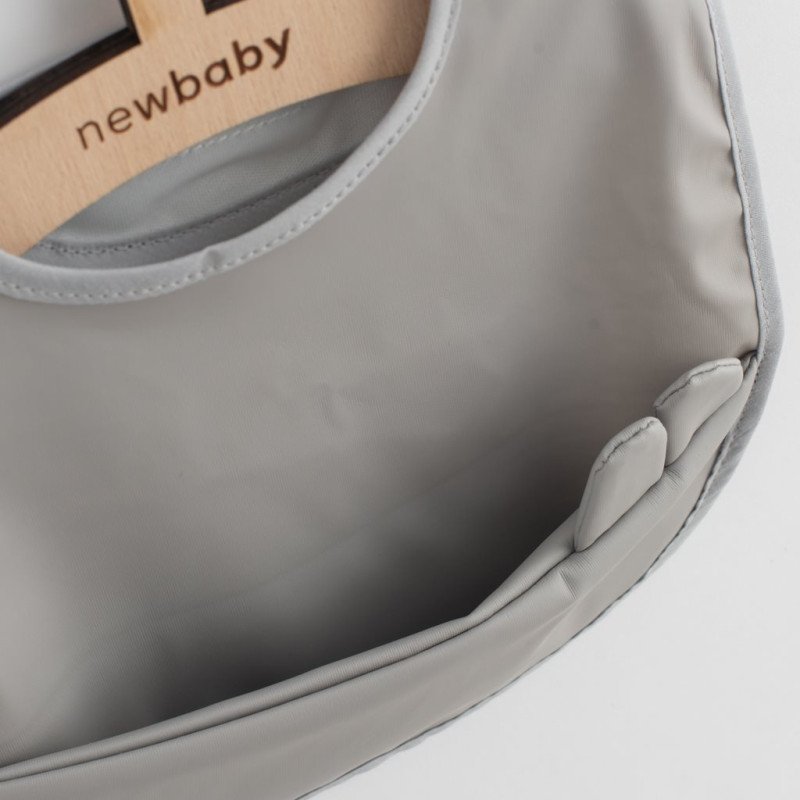 Umývateľný podbradník New Baby 34x25 cm sivý